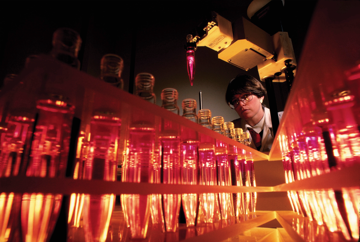 A scientist with test tubes A scientist with test tubes