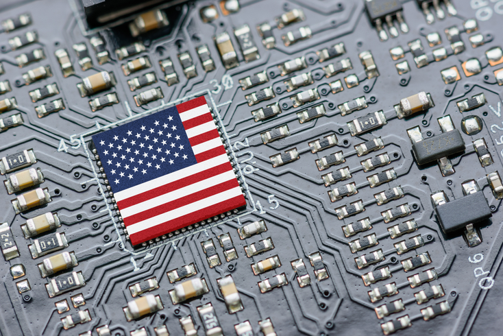 An image of the US flag on a computer chip.