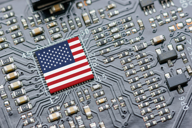 An image of the US flag on a computer chip. An image of the US flag on a computer chip.