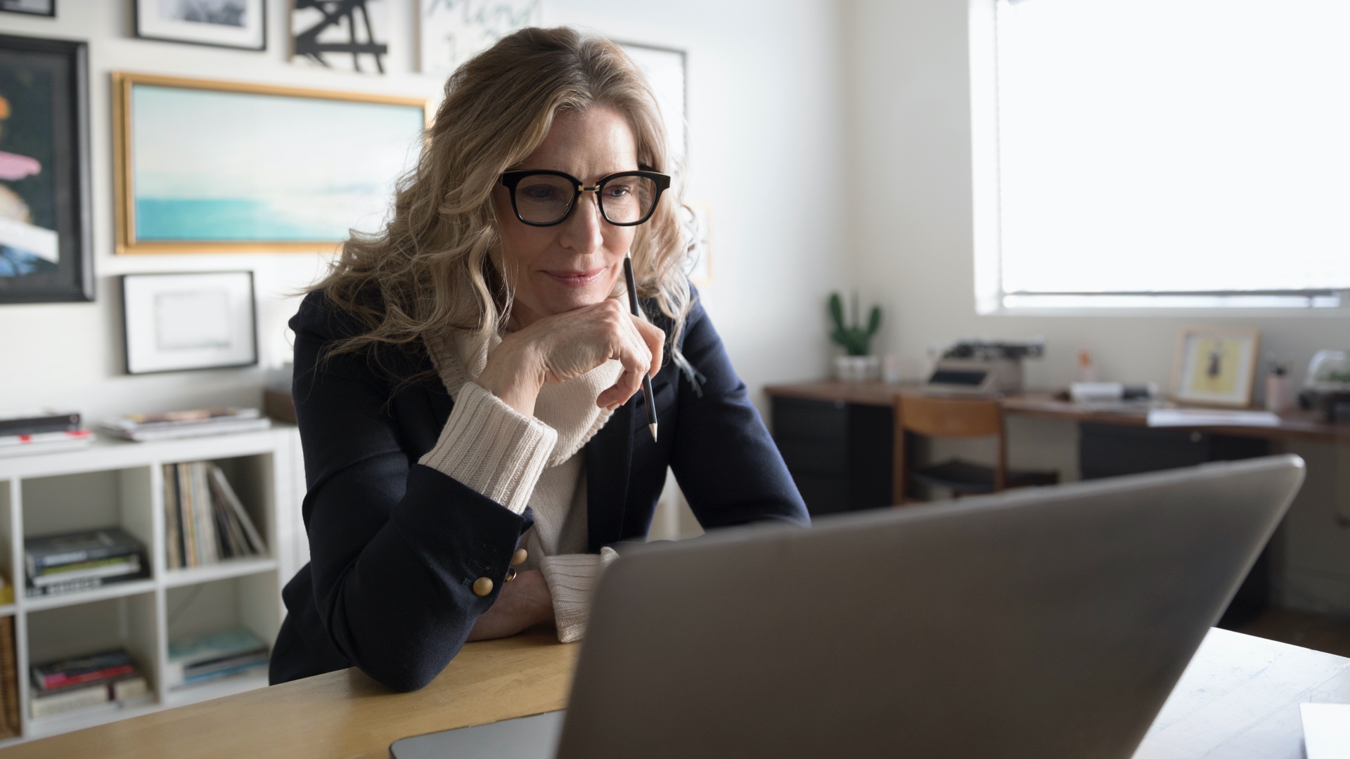 Woman reading from a laptop