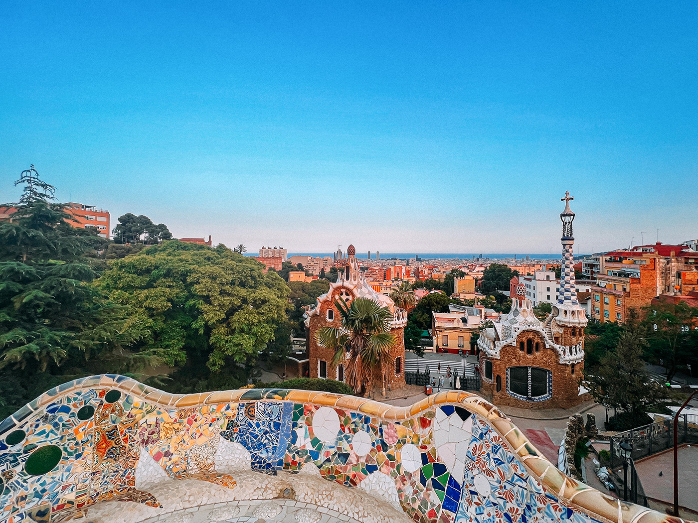 Visit Park Güell for colourful mosaics and views