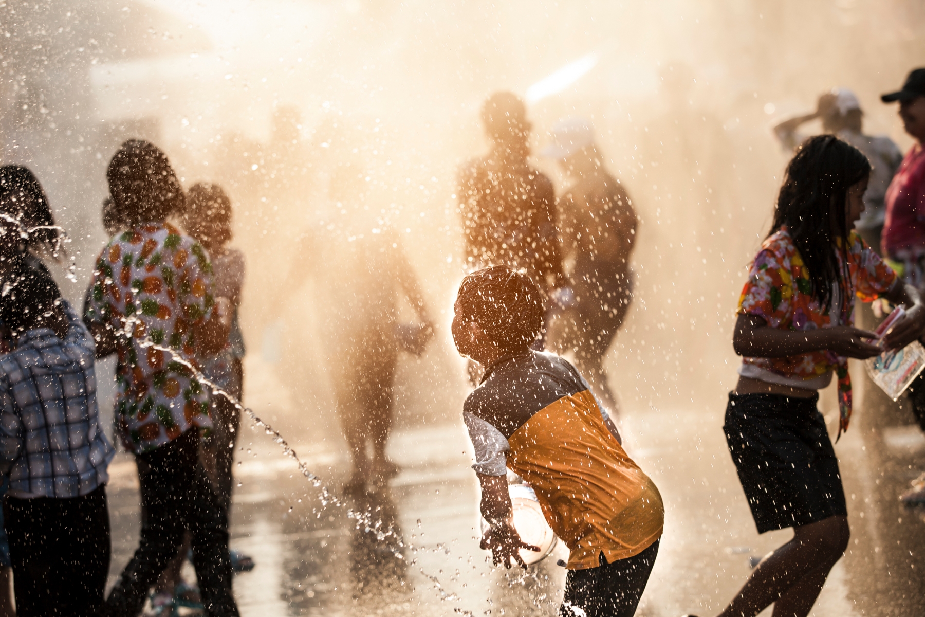 Have a joyful experience while taking in the splash of water on the streets of Bangkok