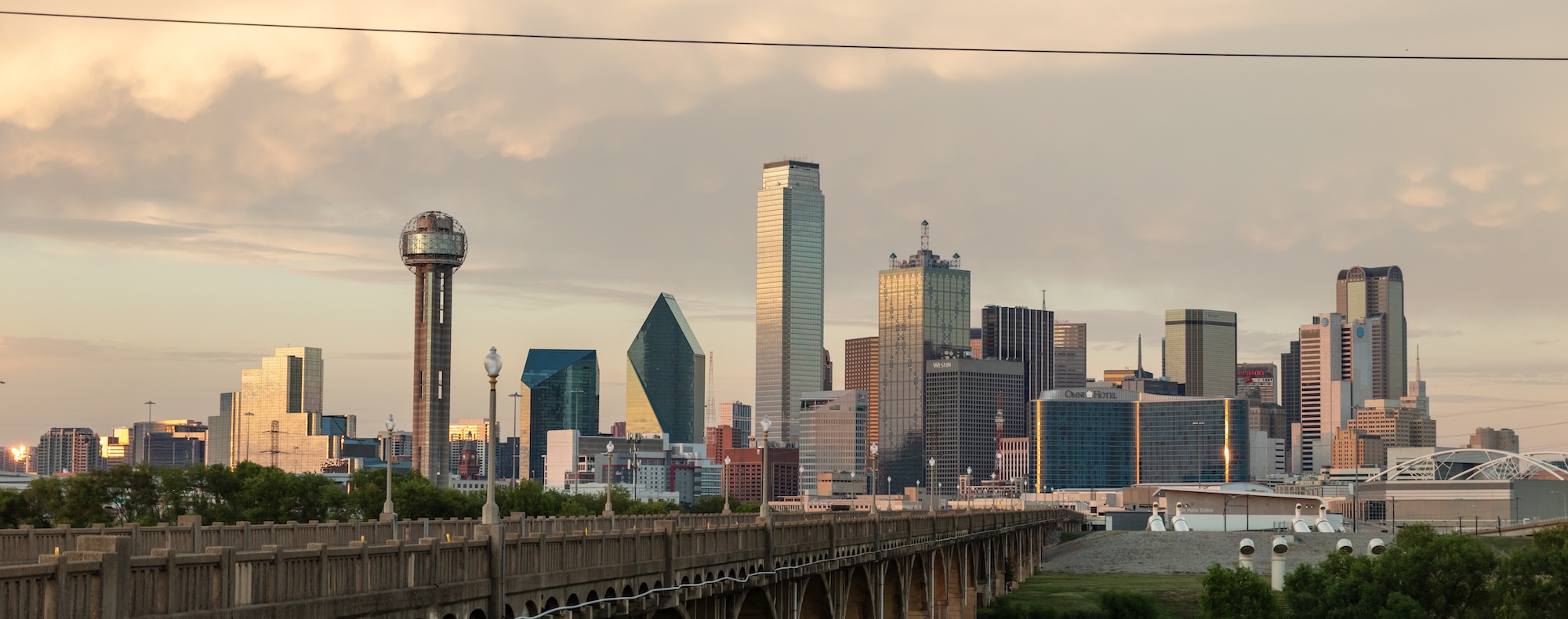 A marmalade hued sunset over Dallas' cityscape