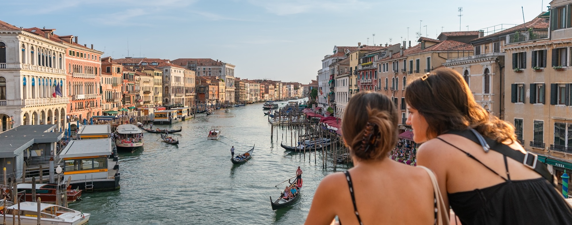 Two women gazing at the Grand Canal in Venice