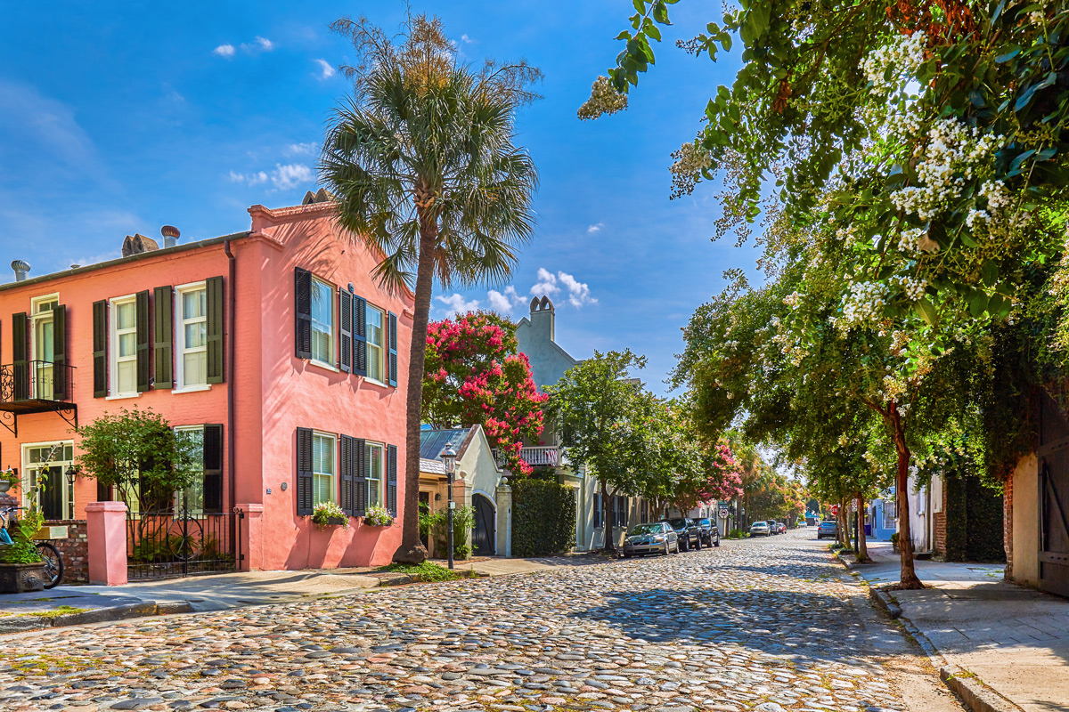 A picturesque cobblestone street in Charleston, SC, showcasing the city's rich history and beautiful architecture.