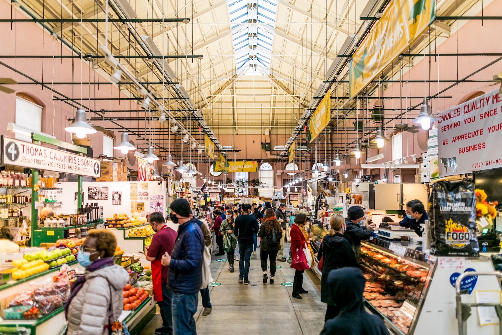 Shoppers exploring various stalls in the vibrant Eastern Market, located in Washington DC