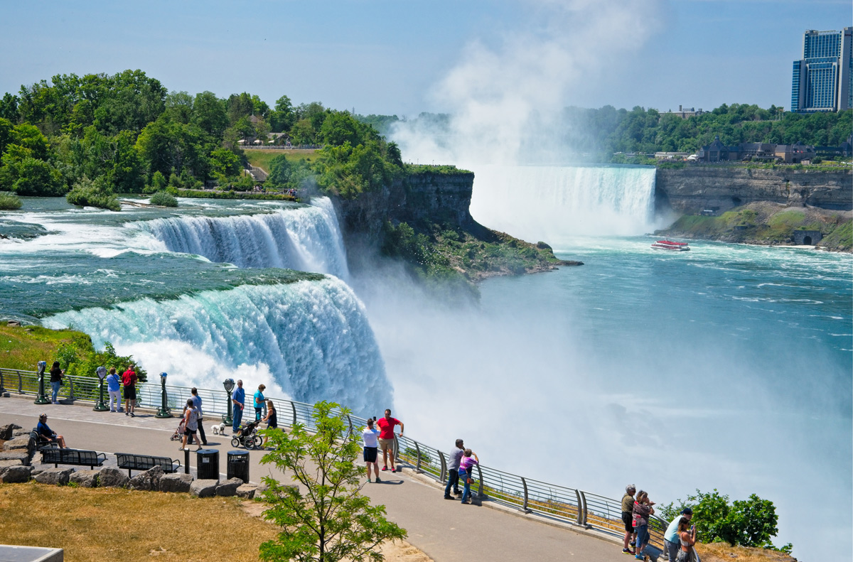 Stunning view of Niagara Falls, showcasing the powerful cascades and mist rising in the air, a natural wonder.