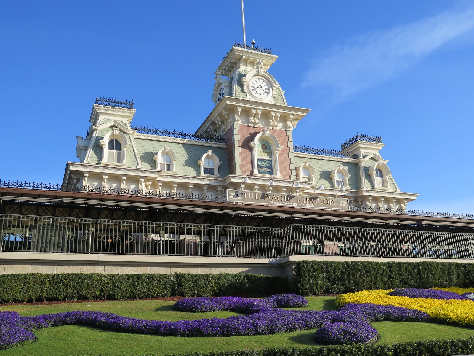 The iconic clock tower building at Magic Kingdom, Disney World, symbolising the park's whimsical charm