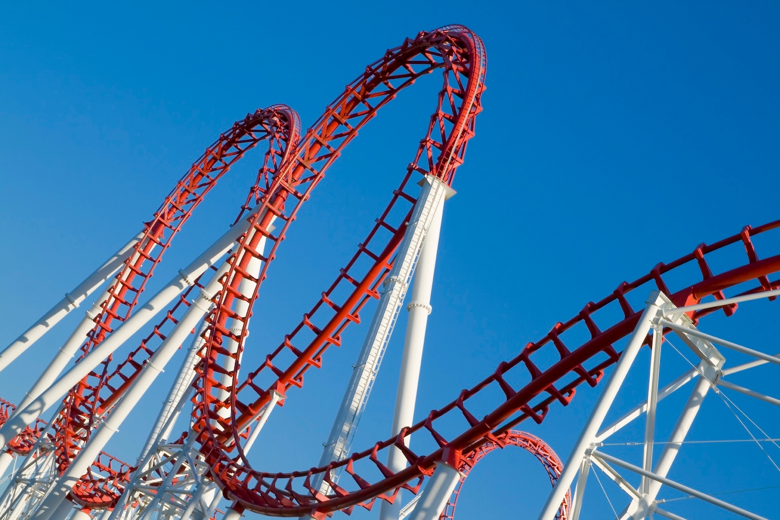 A thrilling, empty, roller coaster ride at Disneyland California, with a colourful track against the vibrant sky