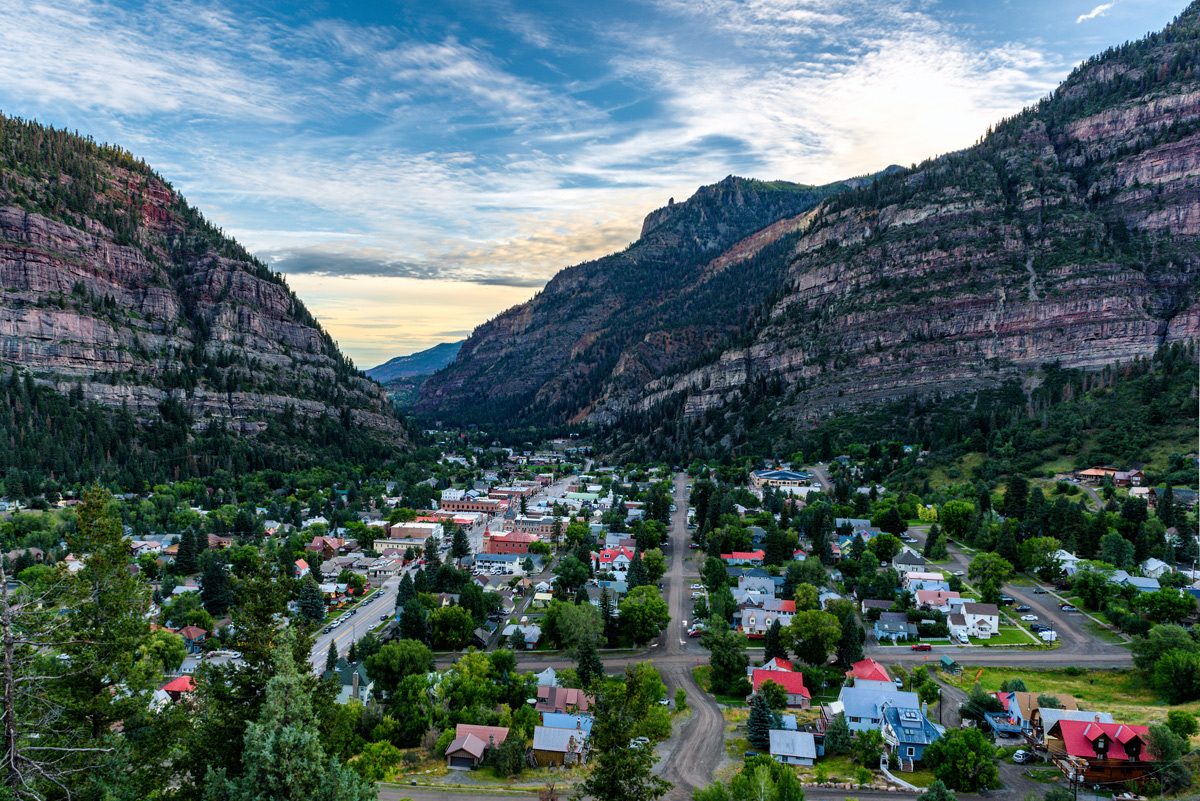Ouray, Colorado: a charming town located in a serene mountain valley, framed by majestic mountains.
