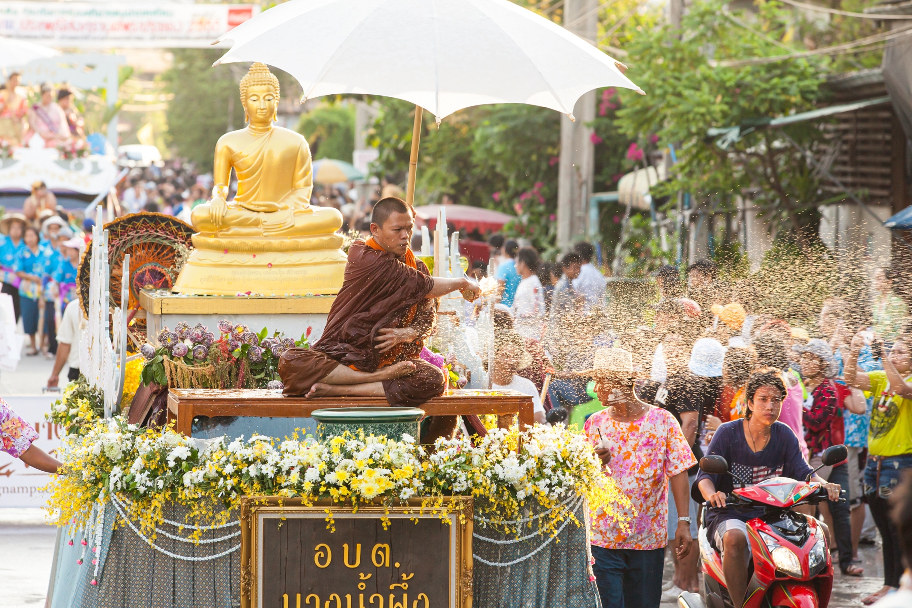 A Buddhist monk sprinkles fragrant water during Songkran