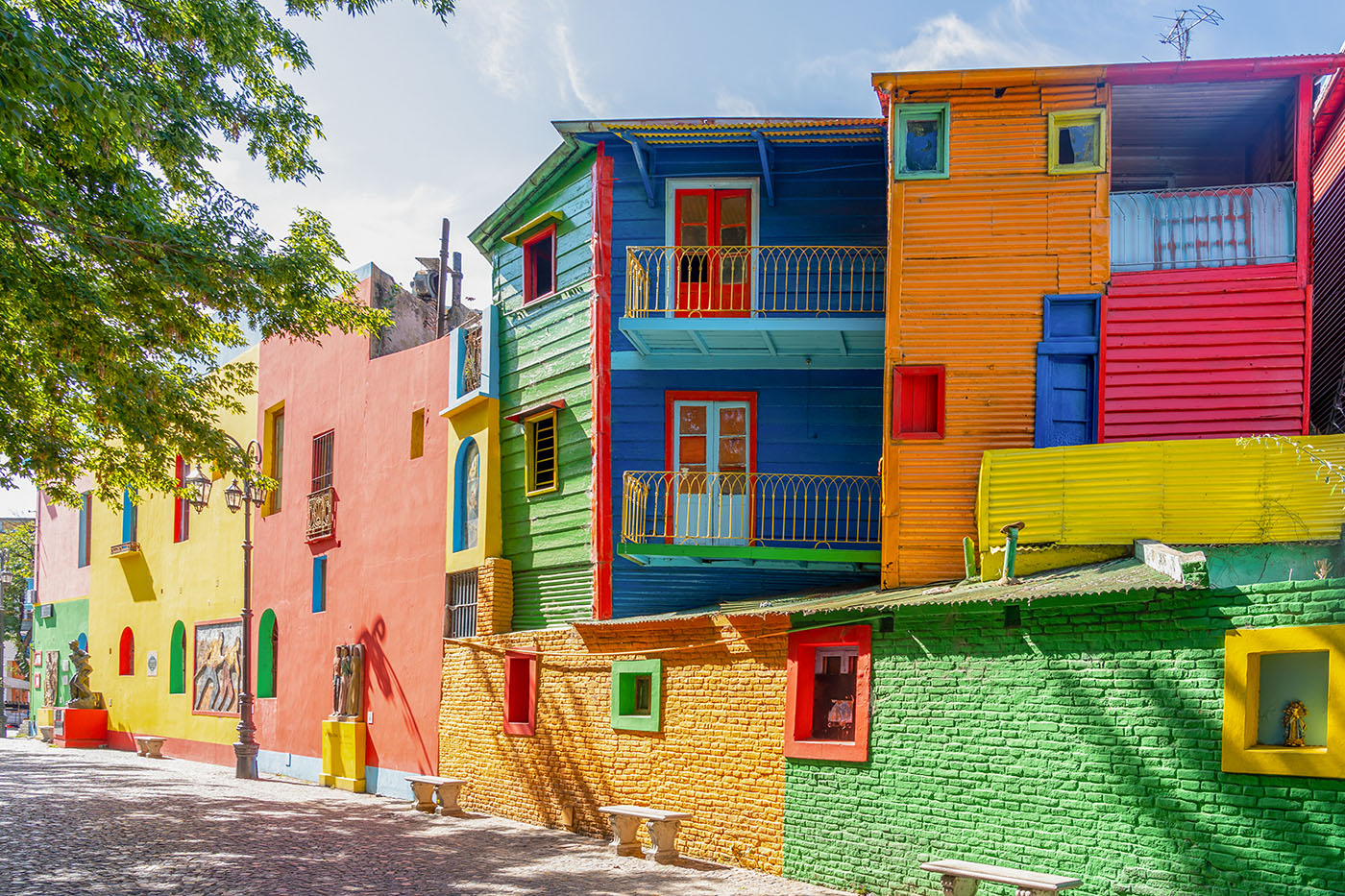 Start your adventure in La Boca, a vibrant neighborhood pulsating with colorful streets and the captivating beat of tango.