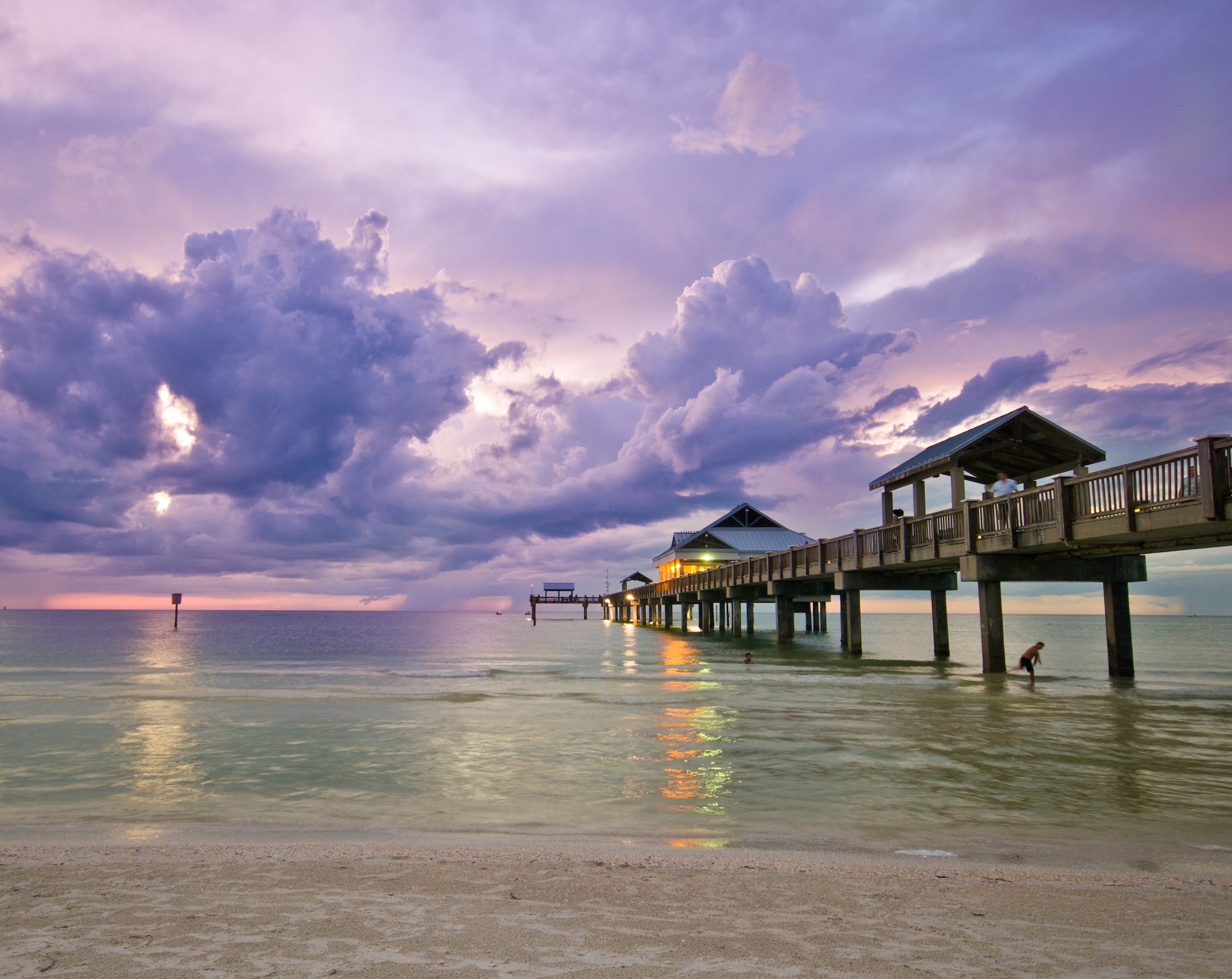 The pier at Clearwater Beach under purple sunset clouds