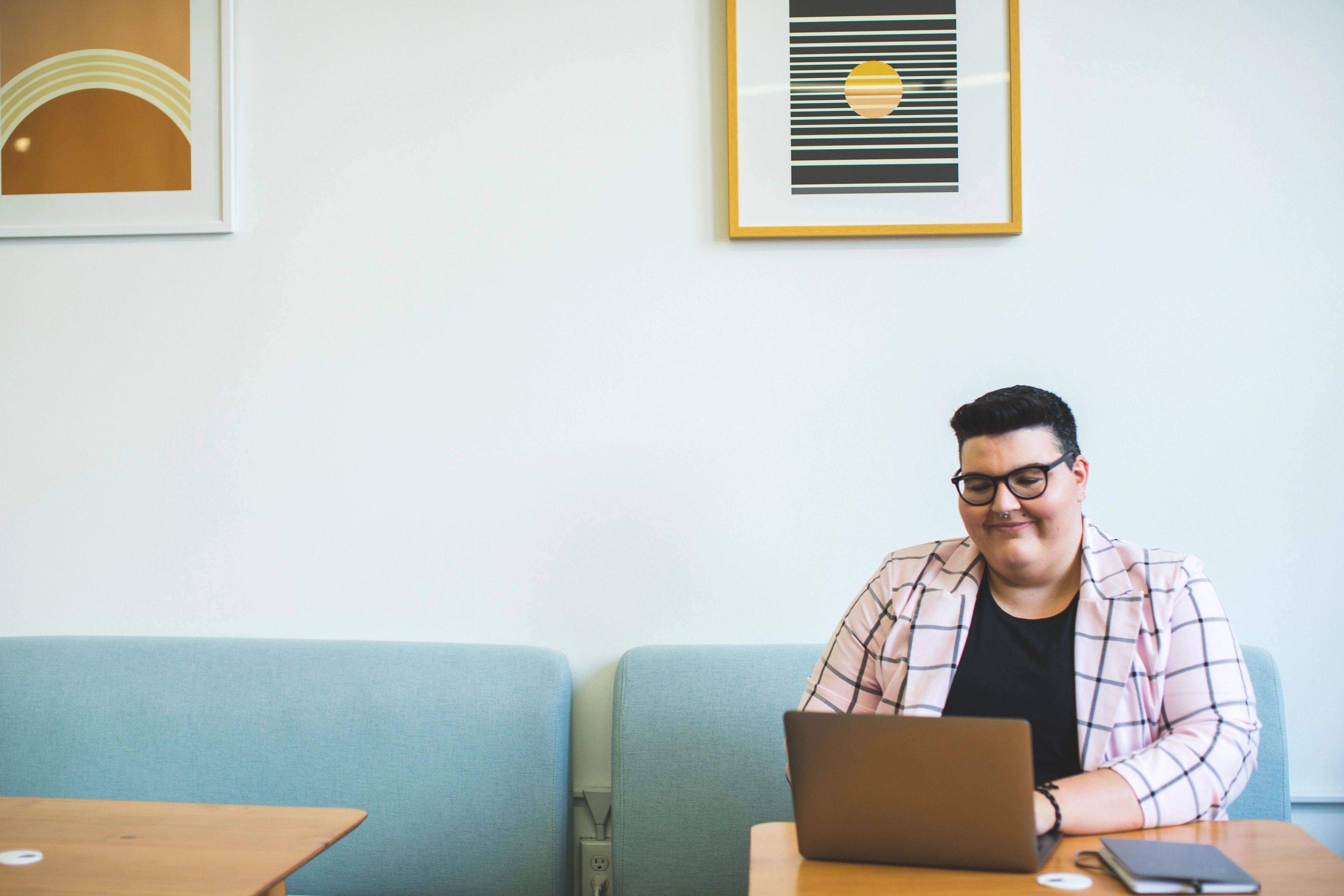 person sitting in a cafe using a laptop.jpg