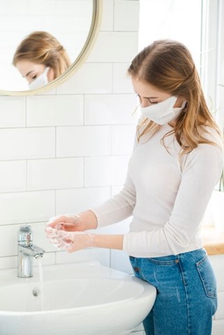 a woman washing hands