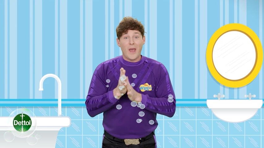 a man washing hands on an animated blue background