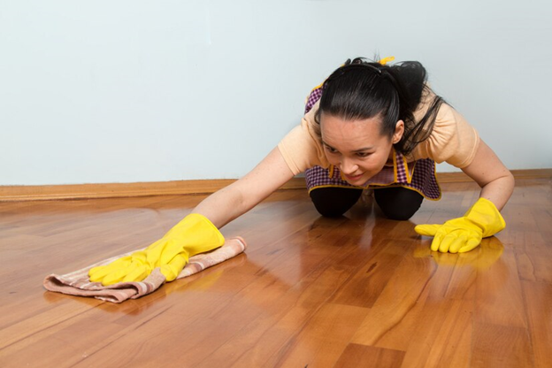 A person wiping the floor