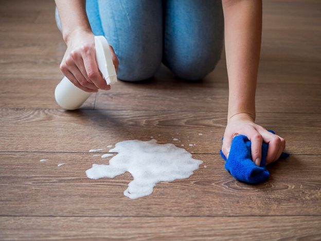 A person cleaning the floor
