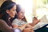 Woman and child completing a word puzzle