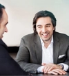 Partner Paolo Notarnicola talks with Partner Mark Fariborz.