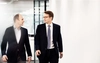 Partner and Head of Portfolio Operations Team Jérôme Losson walks with Partner Jan Kengelbach in a hallway.