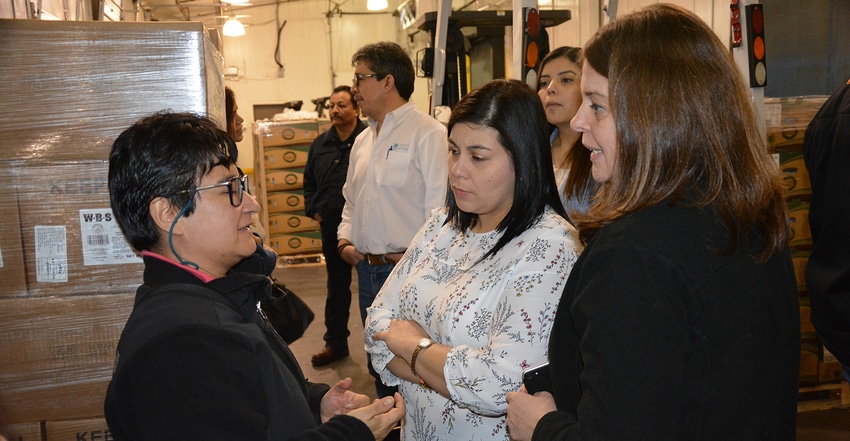 Alejandra Valdez (left), USMEF technical services manager for Mexico, Central America and the Dominican Republic, discusses l