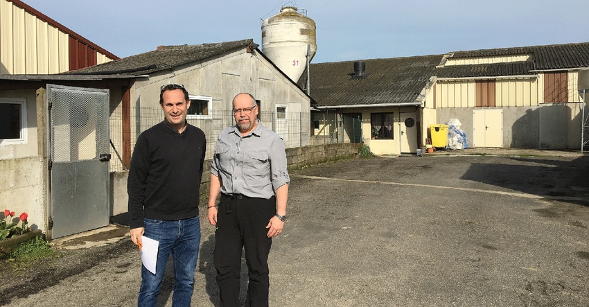 Jean-Pierre Vaillancourt (left) and Frédéric Colin of Zoetis are at a swine farrow-to-finish farm north of Nantes, France. 