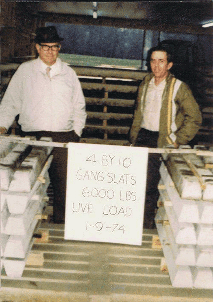 Billy Herring (right), along with Dick Jordan, a former partner in Hog Slat, performs a live-load slat test in 1974.