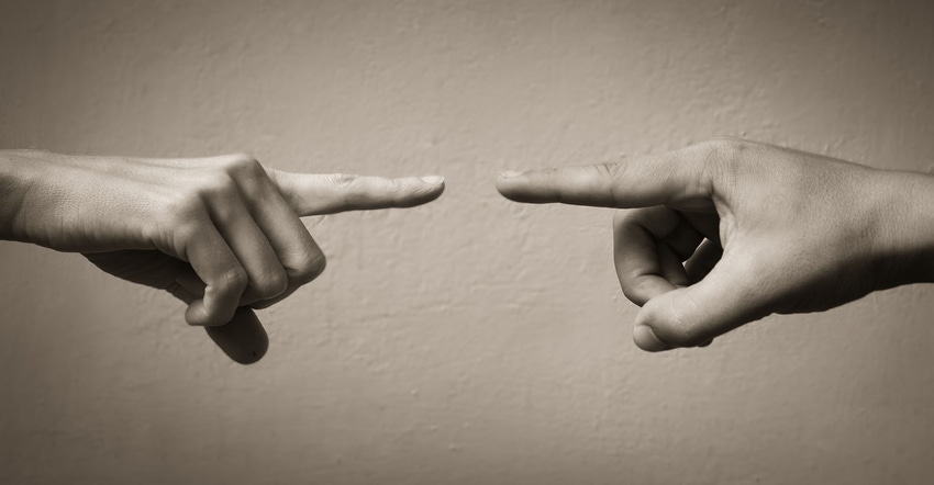 Finger pointing, illustrating conflict