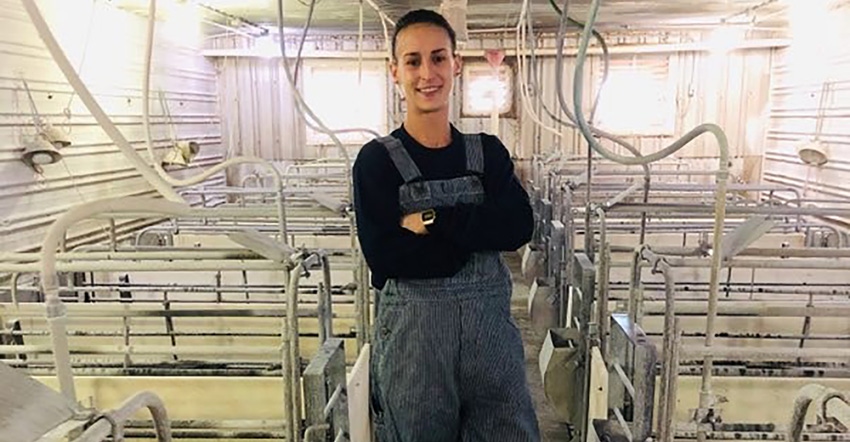 Sow farm manager Brittany Major in a freshly washed and limed room.