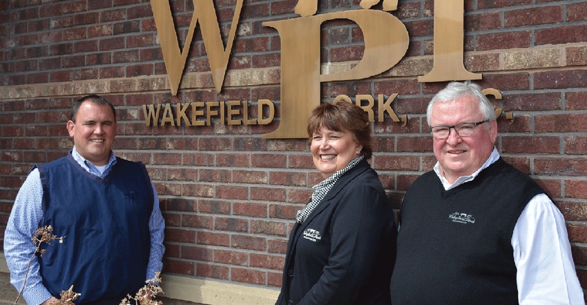 Lincoln (left), Mary and Steve Langhorst, the owners of Wakefield Pork Inc., know the strength of the company is in the value