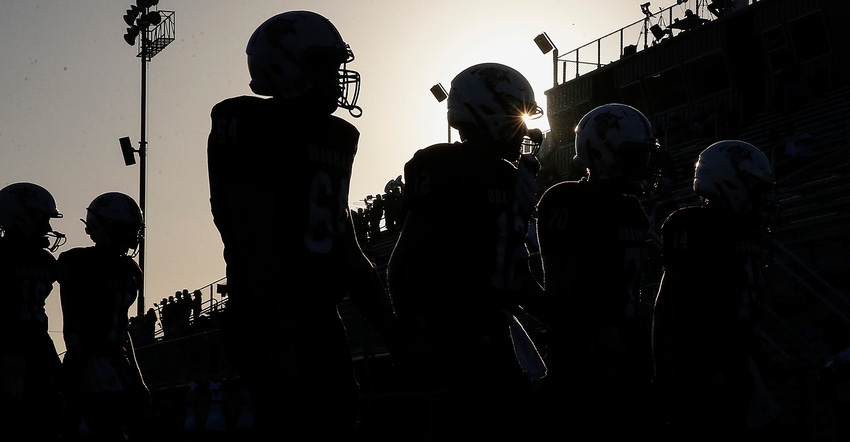 Silhouette of high school football players
