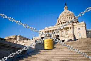 U.S. capitol building with chains and padlock during government shutdown