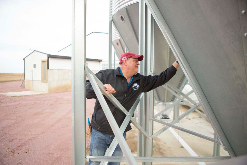 nhf-steverommereim-checkingfeedbins-jpg.jpg nhf-steverommereim-checkingfeedbins-jpg.jpg