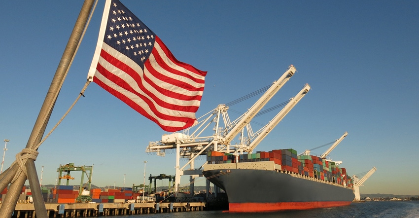 U.S. flag flying ahead of a ship loaded for export