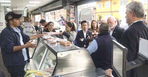 U.S. pork producers and industry leaders visit a retail meat counter in Colombia to explore the variety of cuts and products 