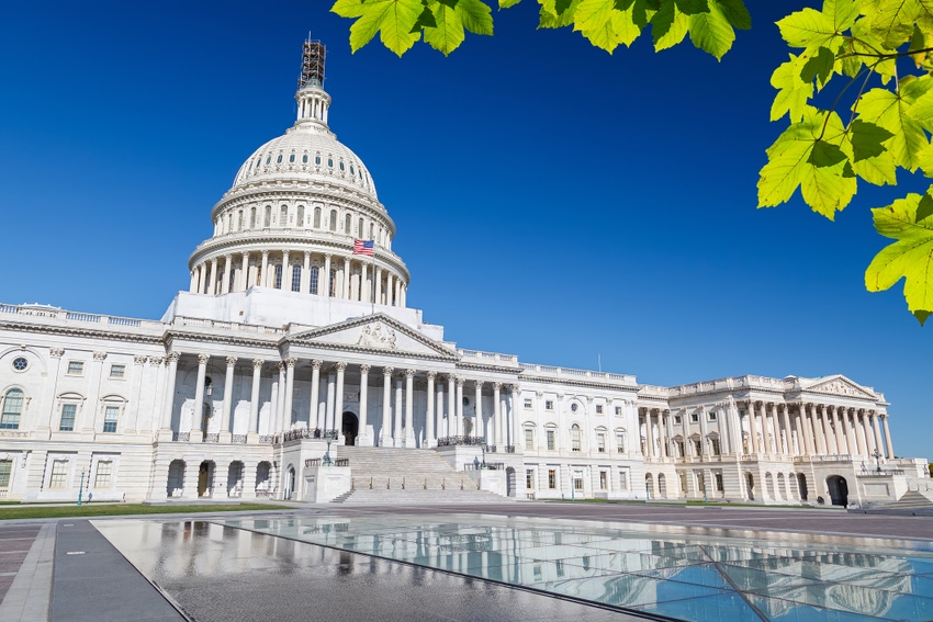 US capitol building in Washington DC against bright blue sky