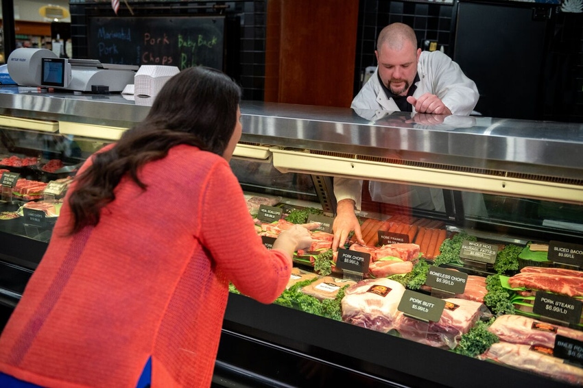 Real Pork – Meat Case with Customer.jpg Real Pork – Meat Case with Customer.jpg