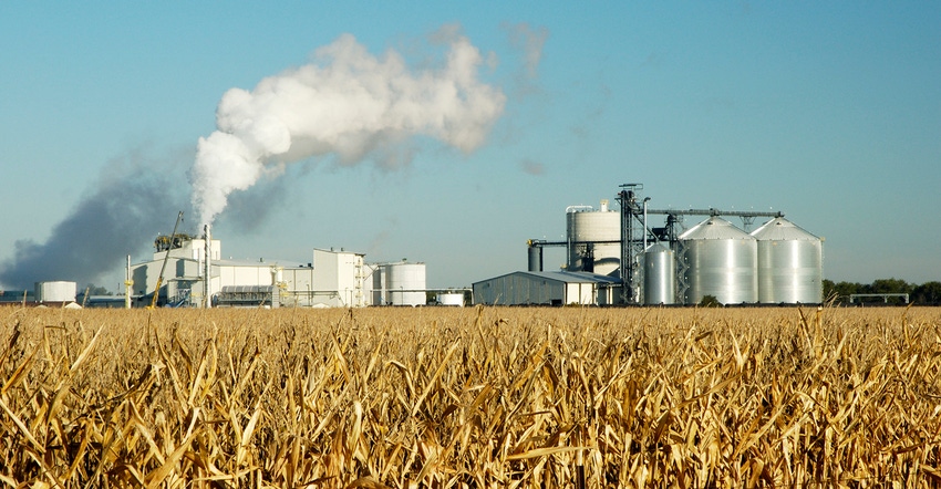 Ethanol plant with a mature cornfield in the foreground