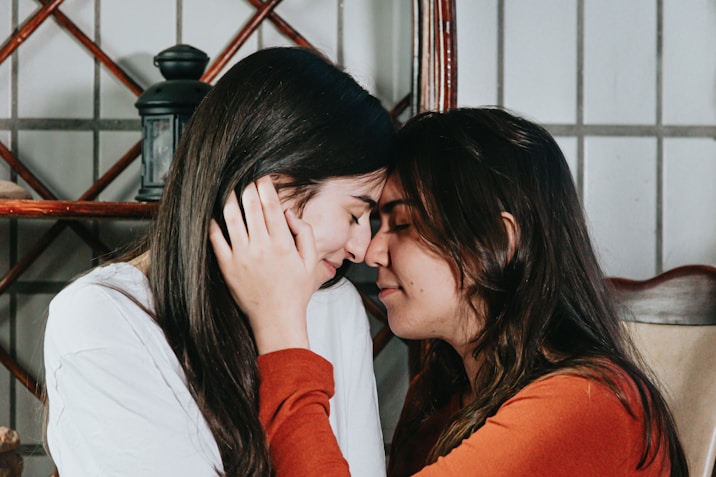 People touching each other forehead