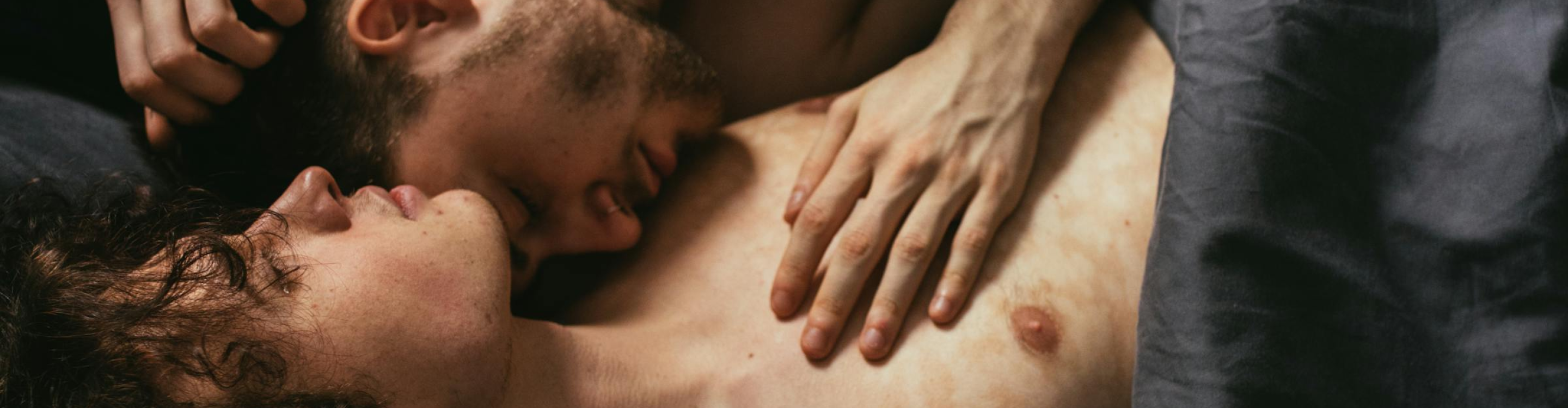 Two men cuddling each other