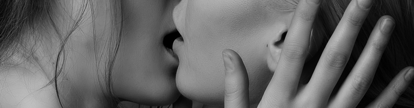 Two female kissing