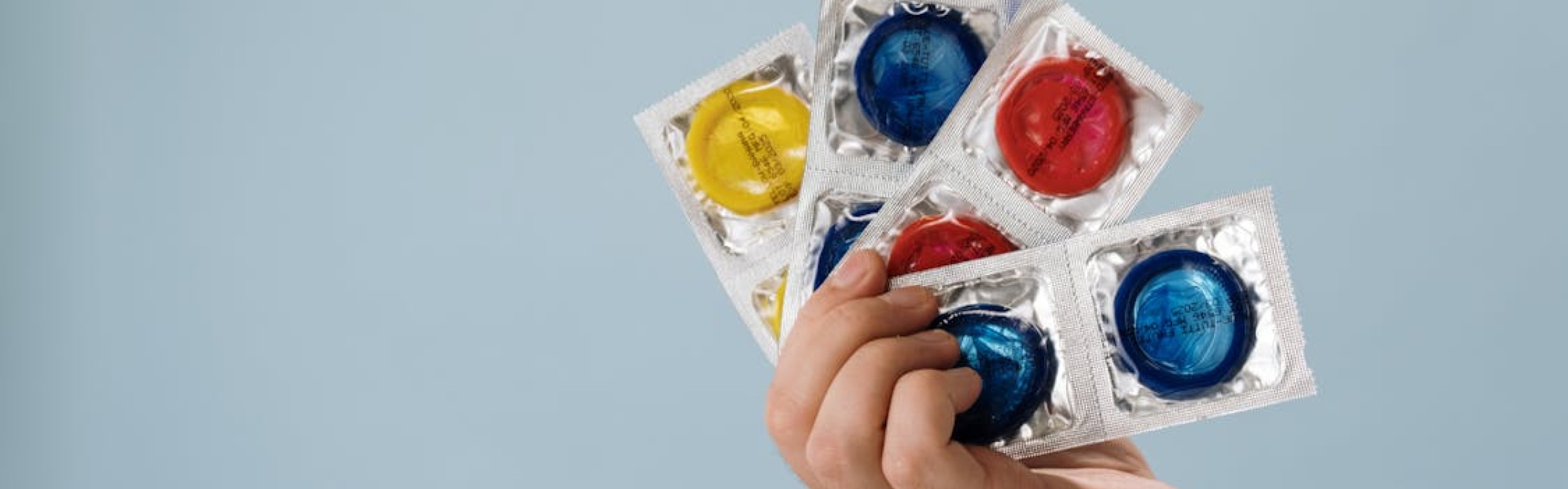 A person touching a strawberry