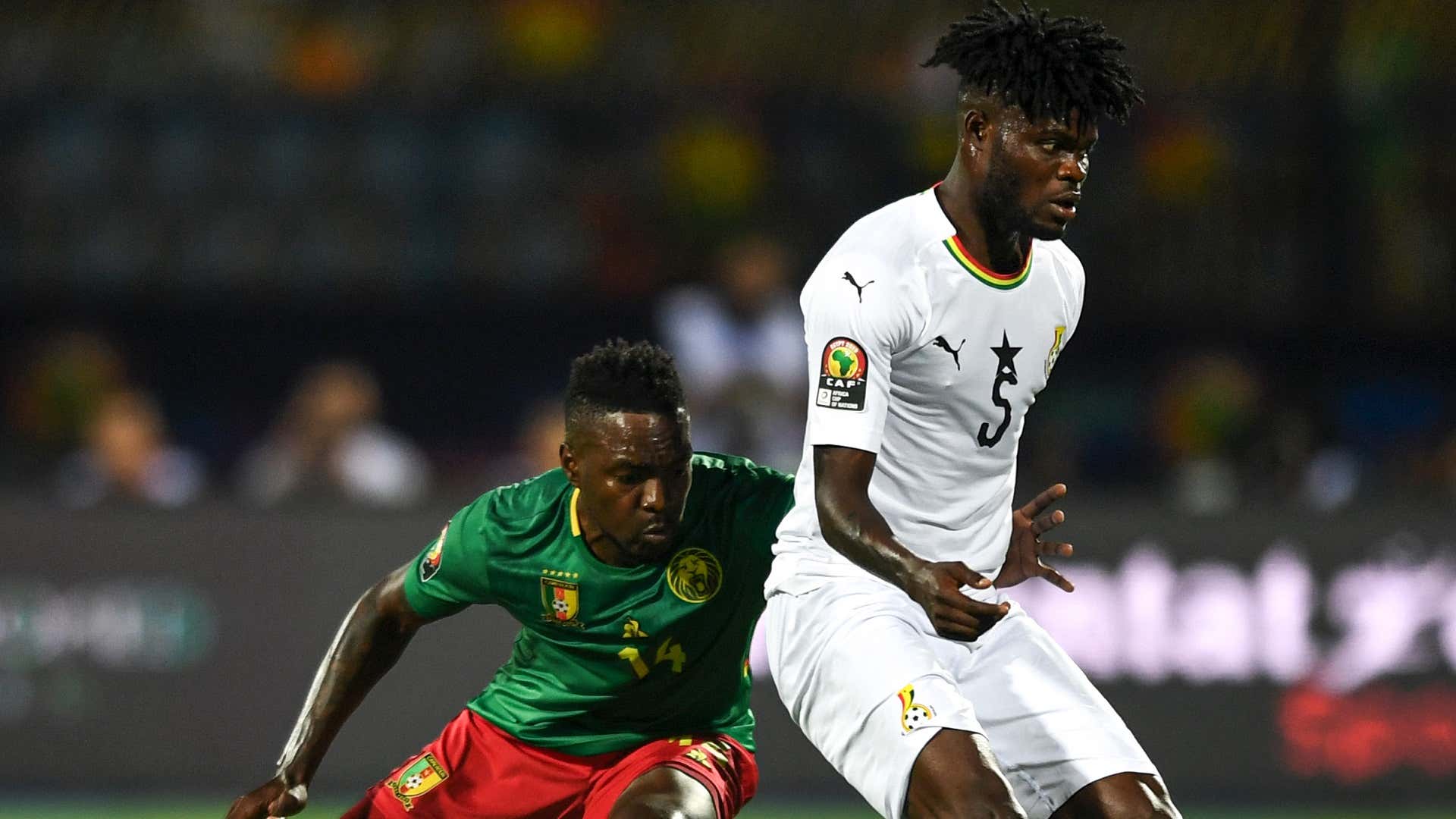 Cameroon's midfielder Georges Mandjeck vies for the ball with Ghana's midfielder Thomas Partey during the 2019 Africa Cup of Nations
