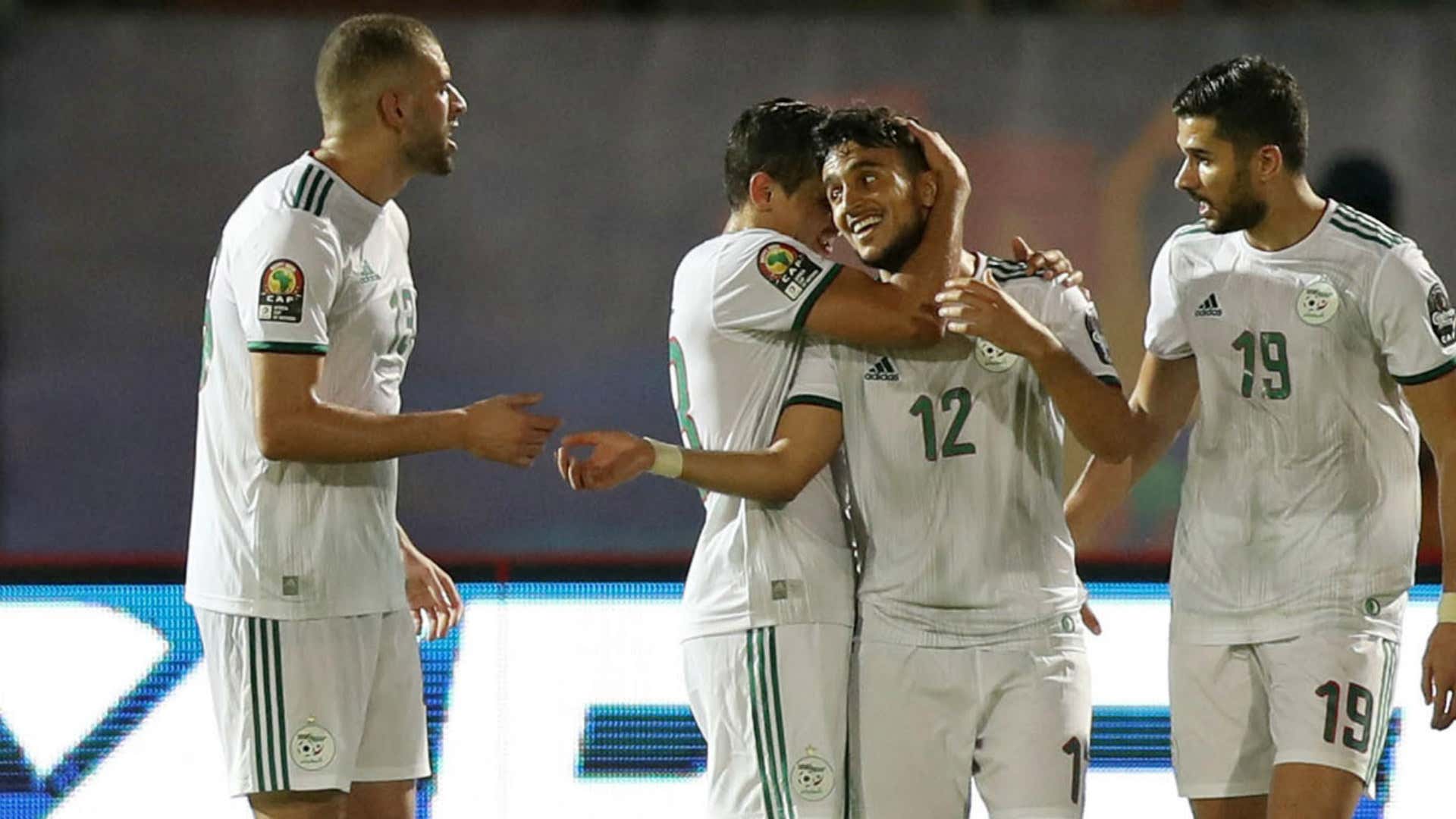 Adam Ounas of Algeria (C) celebrates goal with teammates
