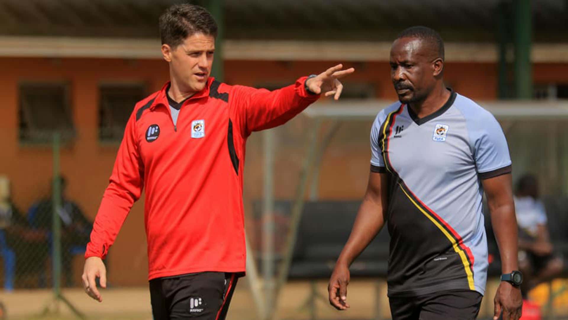 Uganda Cranes coach Johnathan McKinstry and Abdallah Mubiru.