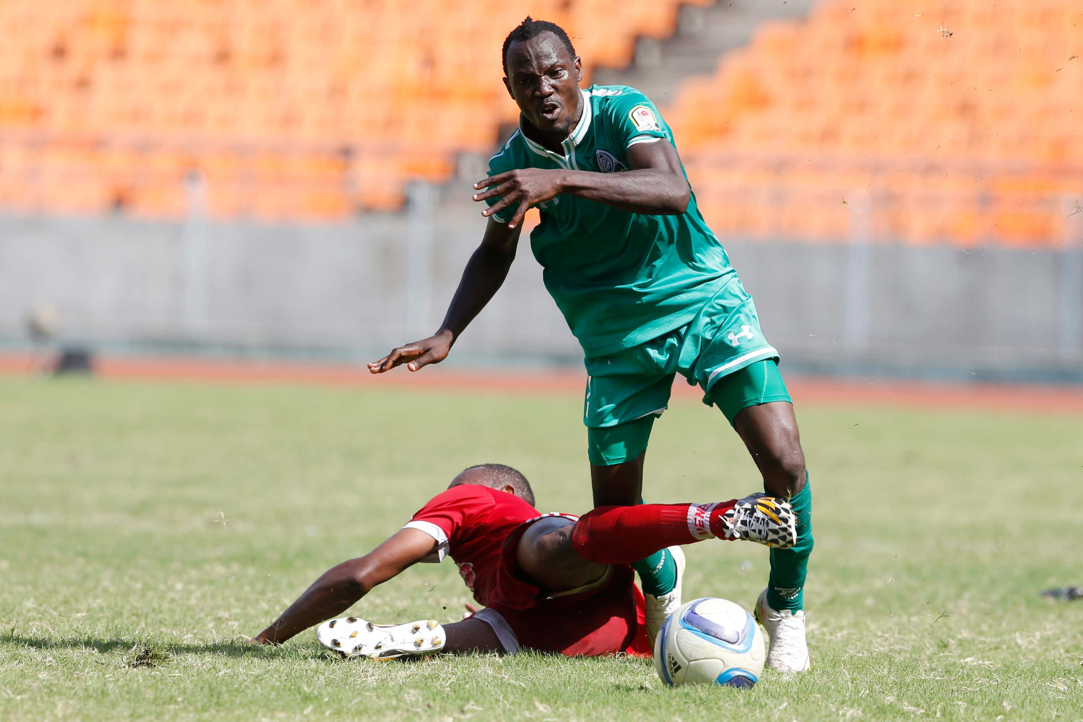 Samawal Merghani of Al Khartoum NSC tackles Godfrey Walusimbi of Gor Mahia FC