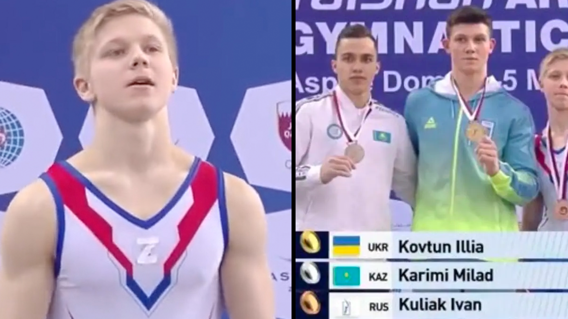 Russian gymnast stands on the podium with symbol supporting