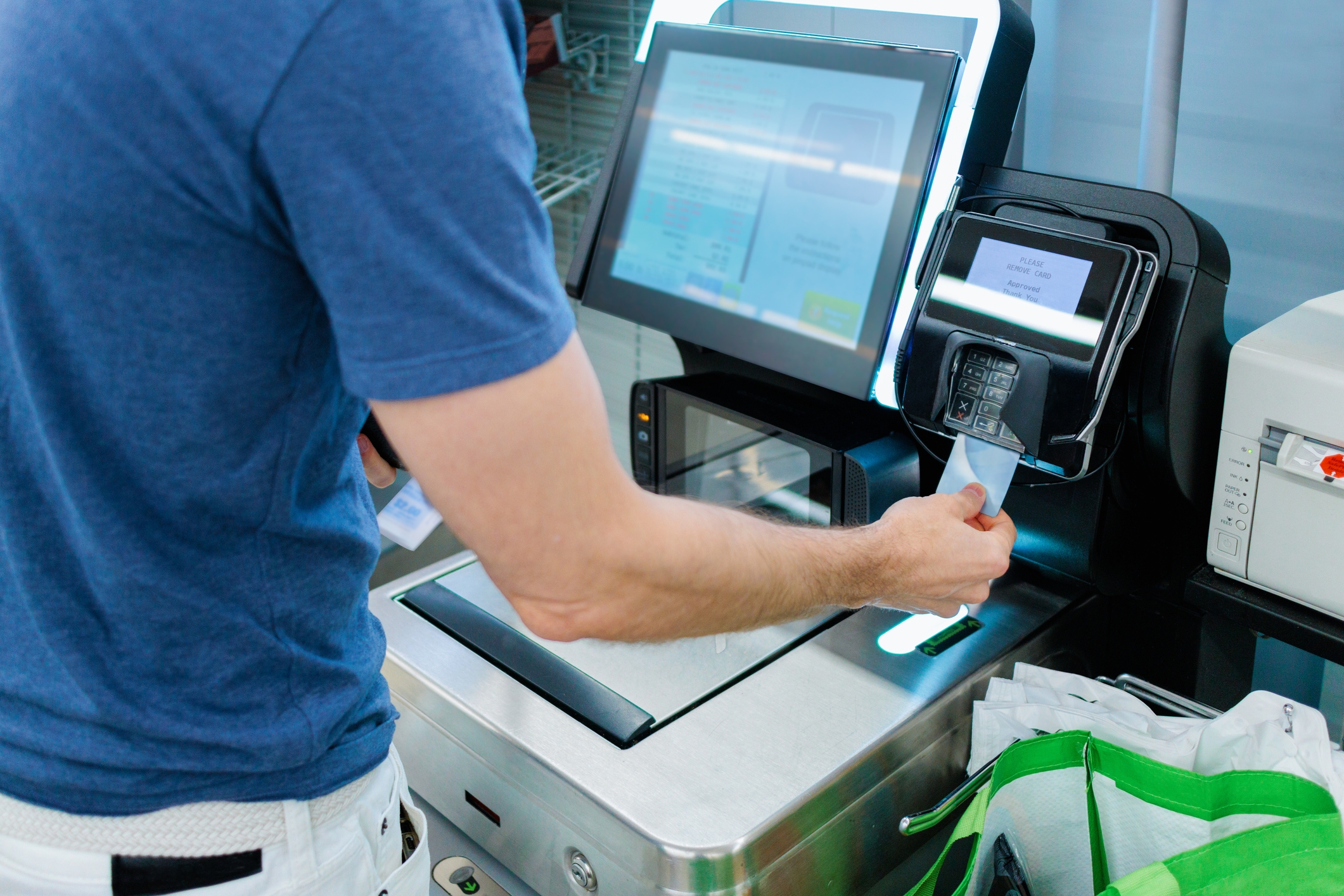 Self-service: Booths supermarket puts staff back behind its tills - BBC News