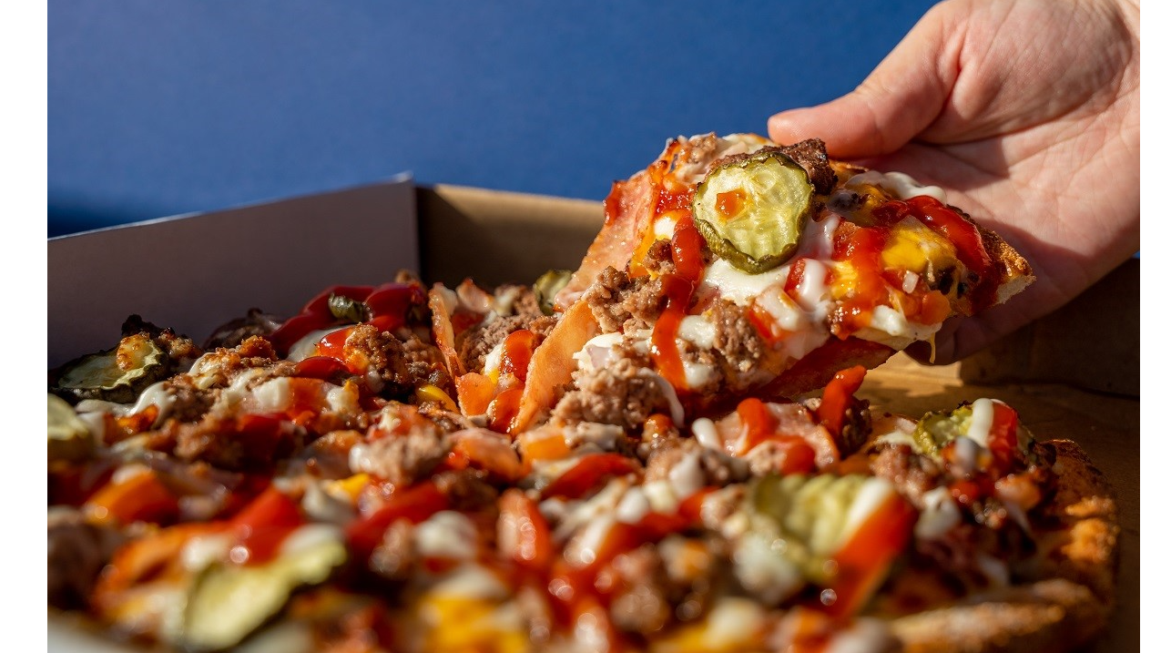 Domino's Australia is launching a new pizza burger to rival McDonald's